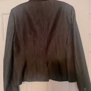 black suit jacket in size 10.  navy and white polkadot lining.